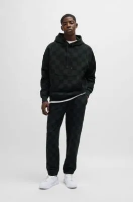 Loose-fit tracksuit bottoms with checkerboard print