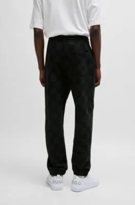 Loose-fit tracksuit bottoms with checkerboard print