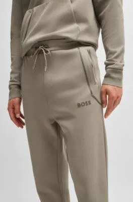 Tracksuit bottoms with mirror-effect logo