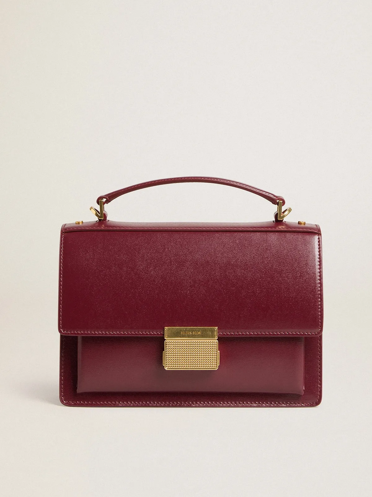 Venezia Bag in burgundy boarded leather with gold details